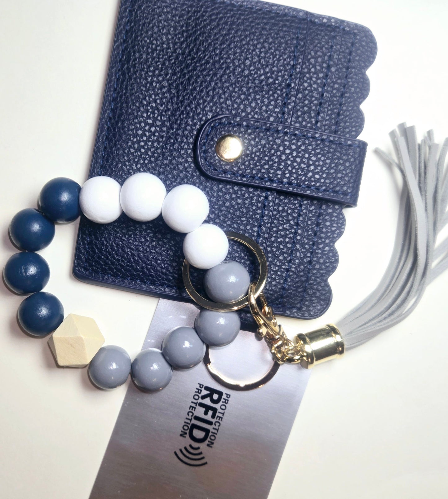 Leather wallet keychain, beaded bracelet.Keychain tassel and C.Card protection included