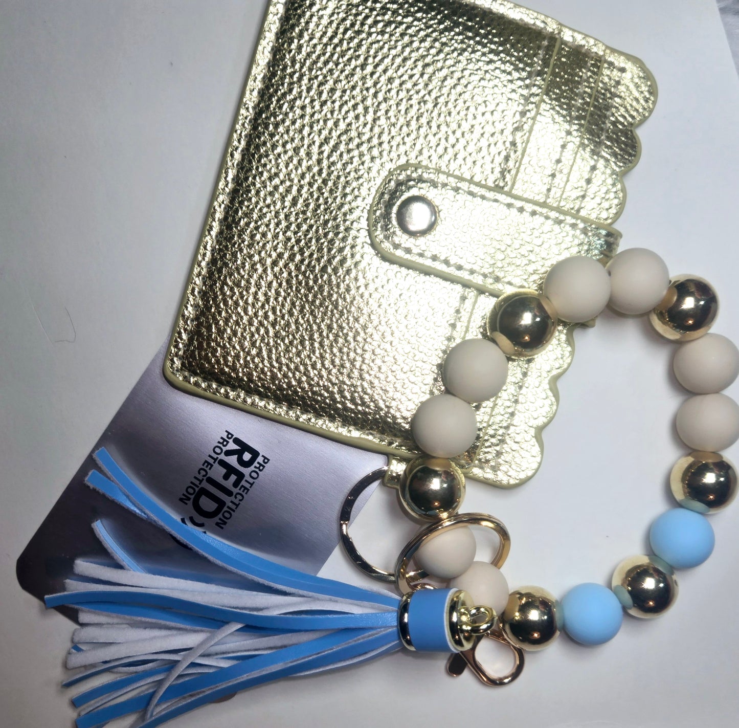 Leather wallet keychain, beaded bracelet.Keychain tassel and C.Card protection included