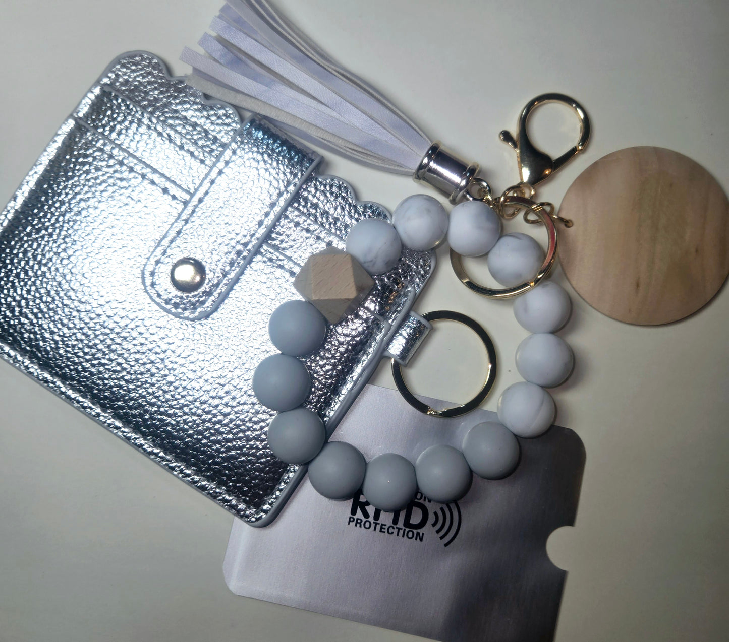 Leather wallet keychain, beaded bracelet.Keychain tassel and C.Card protection included