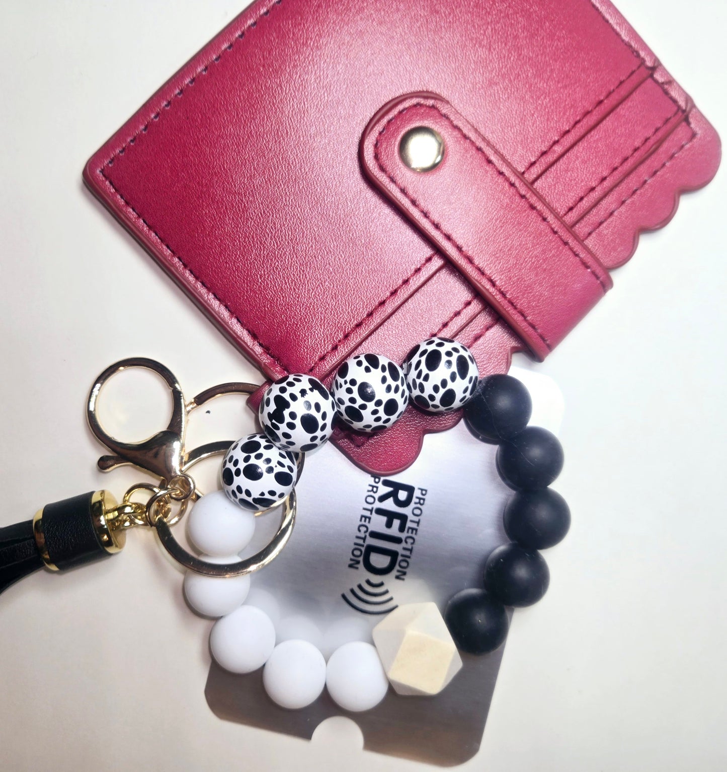 Leather wallet keychain, beaded bracelet.Keychain tassel and C.Card protection included