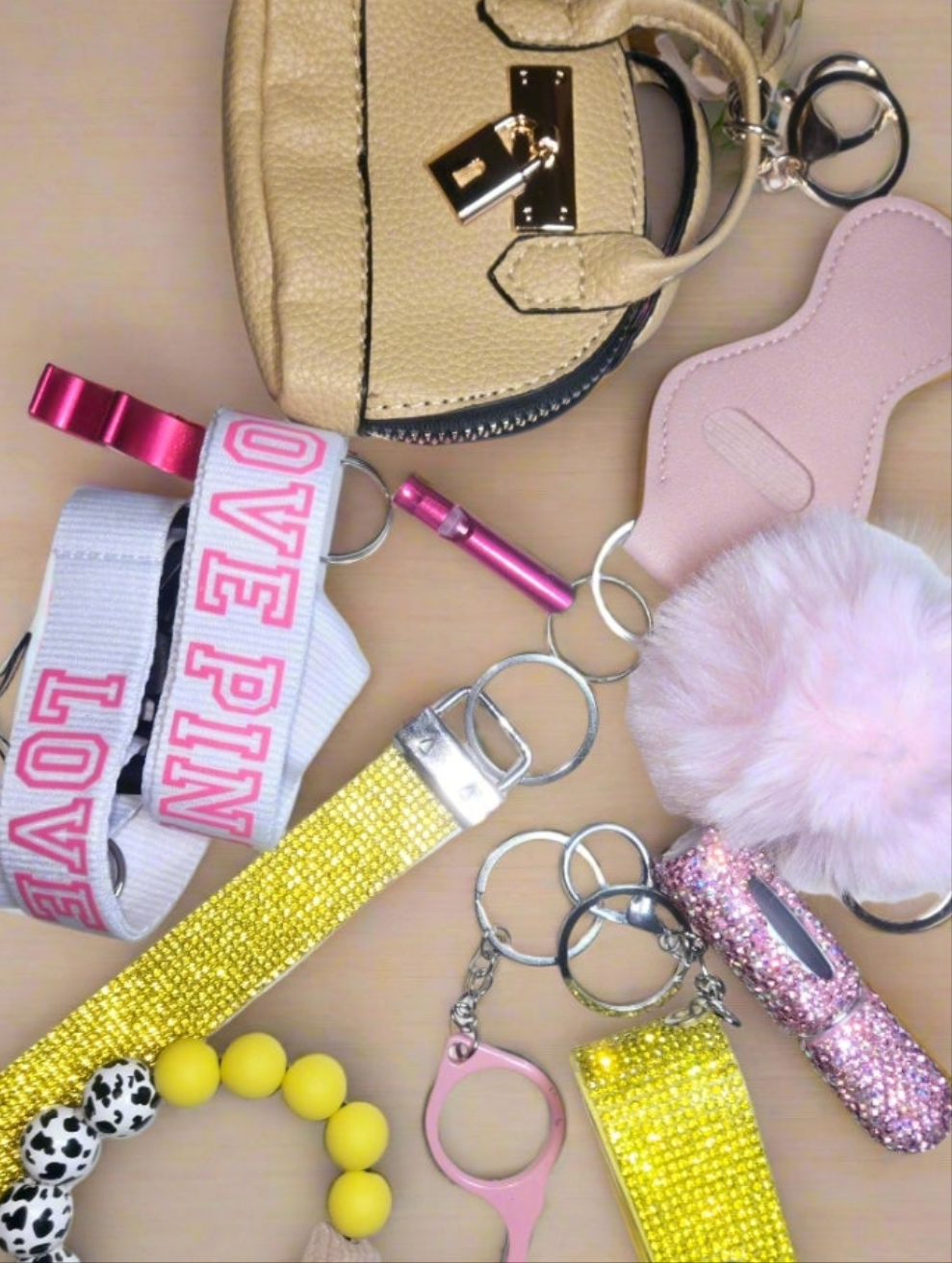 We Don't fit in' BLING KEYCHAIN SET. Includes bag pouch, LPINK Lanyard,  beaded bracelet, totals 15items plus LARGE LUGGAGE