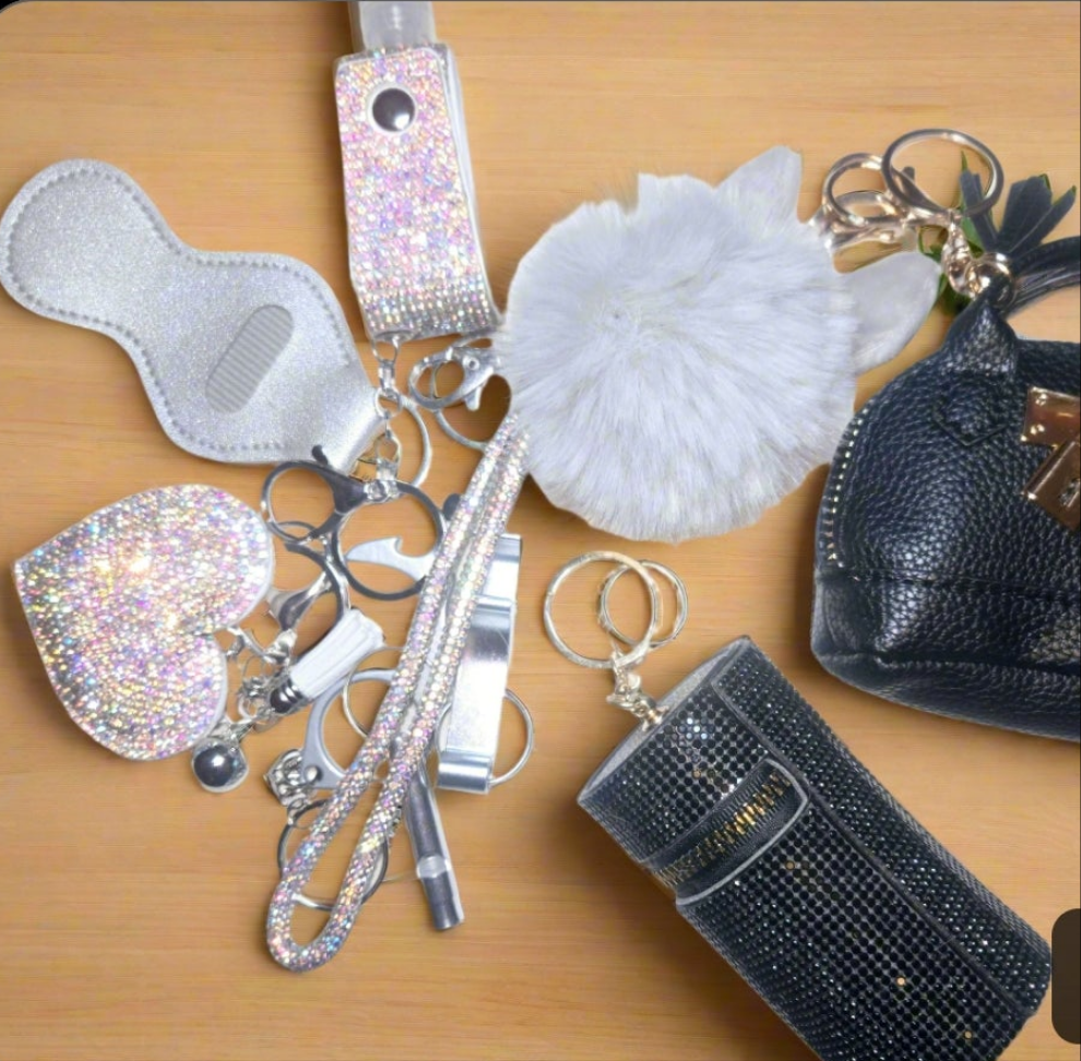 We Don't fit in' BLING KEYCHAIN SET. Includes bag pouch, LPINK Lanyard,  beaded bracelet, totals 15items plus LARGE LUGGAGE