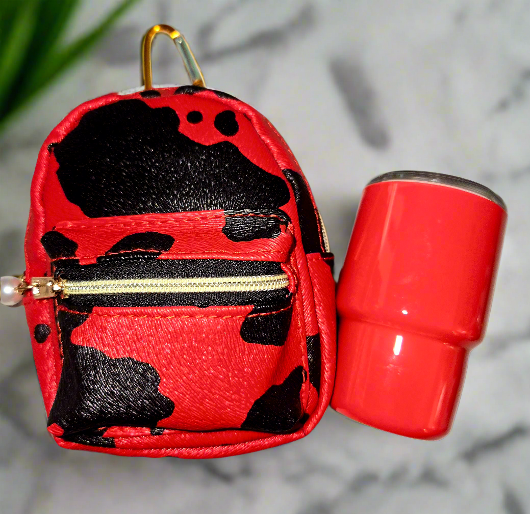 CowGirls Mini, Limited Edition Including this adorable, large mini backpack, keychain purse with a two ounce tumblr, straw with a freebie