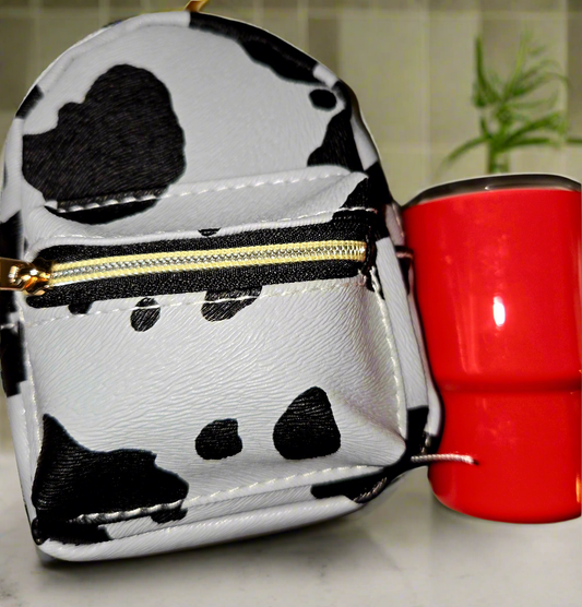 CowGirls Mini, Limited Edition Including this adorable, large mini backpack, keychain purse with a two ounce tumblr, straw with a freebie